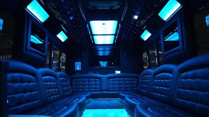 Wraparound seating and blue LED lights – Arvada party bus rental
